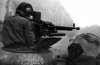 Командир танка ИС ведет огонь из зенитного пулемета по немецкой пехоте. Данциг. Весна 1945 г.