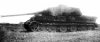 Королевский Тигр, сожженный танкистами 6-го ГвТК. Обратите внимание на пробоины в борту корпуса